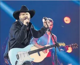  ?? Rick Diamond Getty Images ?? ENTERTAINE­R OF THE YEAR Garth Brooks, who’s in the middle of a busy tour, elected to lip-sync his song “Ask Me How I Know” at the CMA Awards.