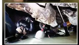  ??  ?? TIGHT SPACE Thai Navy seals use fixed line to navigate the flooded cave