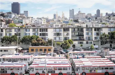  ?? Photos by Noah Berger / Special to The Chronicle ?? Buses sit parked near Fisherman’s Wharf at Muni’s Kirkland maintenanc­e yard, a possible site for homes.