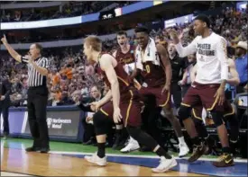  ?? TONY GUTIERREZ — THE ASSOCIATED PRESS ?? The bench celebrates after Loyola-Chicago guard Bruno Skokna scored on a 3-point basket against Tennessee in the second half of a second-round game at the NCAA men’s college basketball tournament in Dallas, Saturday.