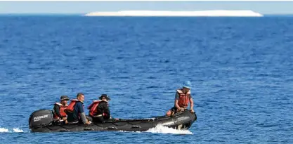  ?? —AFP ?? CODE OF CONDUCT File photo shows members of a Philippine survey team sailing around Philippine-held Pag-asa (Thitu) Island, with a sandbar seen in the background, in the Spratlys. President Duterte ordered troops to scrap plans of building a...