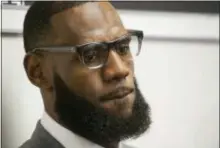  ?? PHIL LONG — THE ASSOCIATED PRESS FILE ?? LeBron James listens to a question at a news conference after the opening ceremony for the I Promise School in Akron, Ohio.