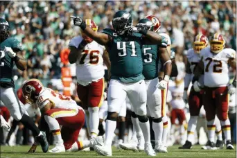  ?? MICHAEL PEREZ — THE ASSOCIATED PRESS ?? Philadelph­ia Eagles’ Fletcher Cox (91) celebrates after tackling Washington Redskins’ Derrius Guice during Sunday’s game.