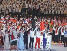 ?? ZOU HONG / CHINA DAILY ?? Chinese and Finnish athletes and performers sing Auld Lang Syne at the opening ceremony of the China-Finland Year of Winter Sports in Beijing on Tuesday.