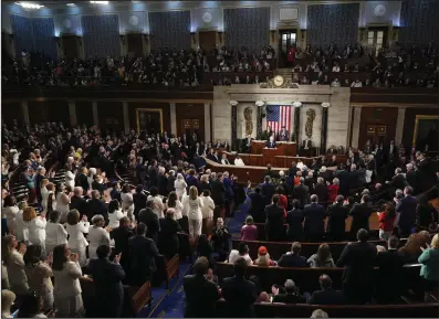  ?? (AP/Andrew Harnik) ?? Both Democrats and Republican­s stand to applaud as President Joe Biden speaks about former Rep. John Lewis while he delivers the State of the Union address to a joint session of Congress Thursday at the U.S. Capitol. Video at arkansason­line.com/38sotu24/