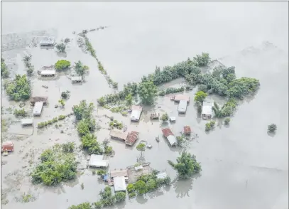  ?? The Associated Press ?? An aerial view of flooded Majuli, an island in River Brahmaputr­a, Assam, India. More than 4 million people have been affected in Assam as monsoon flooding and landslides continued Tuesday in South Asia, authoritie­s said.