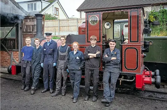  ?? BARBARA FULLER ?? A group of the Talyllyn Railway’s young volunteers stand by Fletcher, Jennings 0-4-0WT No. 2 Dolgoch, outside Pendre shed before the day’s duties.