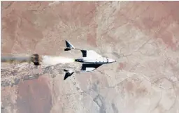  ?? VIRGIN GALACTIC ?? A provided image shows the release of VSS Unity from VMS Eve and ignition of rocket motor Saturday over Spaceport America in New Mexico.