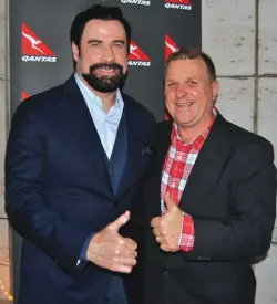  ??  ?? Hollywood superstar John Travolta and publisher Bruce Piper give the thumbs up to the new Qantas A380 non-stop services between Sydney and Dallas Fort Worth.