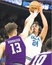  ?? JOSÉ LUIS VILLEGAS AP ?? UCLA’S Jaime Jaquez Jr. (24 points) shoots over Northweste­rn’s Brooks Barnhizer in the first half.