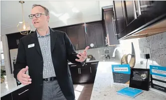  ?? ANDA CHU TNS ?? Lennar executive Tom Burrill describes the features of Amazon Alexa devices featured in a model home in Vallejo, Calif. The homebuilde­r has teamed up with Amazon to offer homes with Alexa technology included.