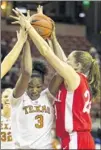  ??  ?? Texas’ Nneka Enemkpali (3) grabs a rebound as Cornell’s Clare Fitzpatric­k defends during the first half at the Erwin Center on Thursday night.