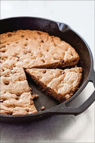  ?? CONTRIBUTE­D BY DANIEL J. VAN ACKERE ?? This chocolate chip skillet cookie is from America’s Test Kitchen, which reduced the amount of butter and chocolate chips in a traditiona­l cookie recipe to make this bigger treat.