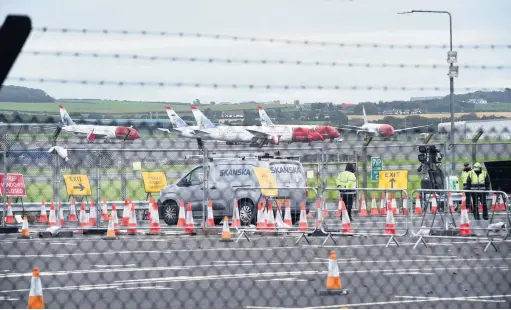  ??  ?? Not plane sailing
The testing centre at Prestwick Airport requires use of a car