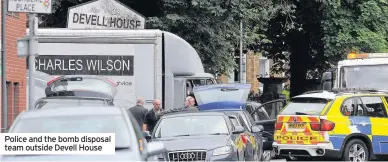  ??  ?? Police and the bomb disposal team outside Devell House