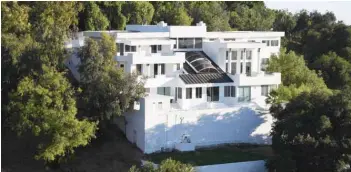  ??  ?? The mansion Palazzo Beverly Hills, where a large party was held in defiance of coronaviru­s-related health order and ended in a fatal shooting, is seen on Mulholland drive in Los Angeles, California. —AFP