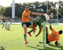  ?? GETTY IMAGES ?? Wallabies wing Marika Koroibete, right, crash-tackles Springboks wing Makazole Mapimpi yesterday.