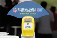  ?? AP Photo/Julio Cortez ?? ■ A sunscreen dispenser is seen in the fan section at the New York Giants NFL football training camp Aug. 2 in East Rutherford, N.J. The NFL and American Cancer Society teamed up this summer to launch an initiative as part of its "Crucial Catch" campaign in which free sunscreen is being provided to players, coaches, fans, team employees and media at camps across the country.