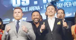  ?? AFP ?? Canelo Alvarez (left) and Gennady Golovkin pose with Oscar De La Hoya (center) during the press tour of their Sept. 16 fight at The Theater at the Madison Square Garden in New York.