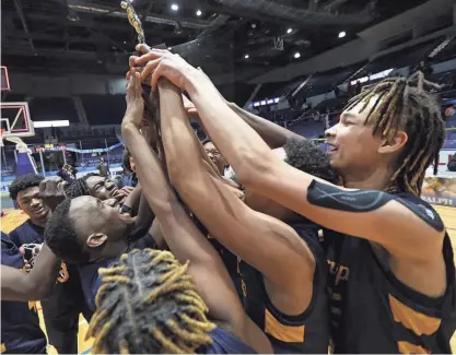  ?? PHOTOS BY TINA MACINTYRE-YEE /ROCHESTER DEMOCRAT AND CHRONICLE ?? UPrep celebrate with their championsh­ip trophy.