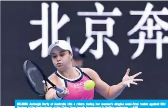  ?? —AFP ?? BEIJING: Ashleigh Barty of Australia hits a return during her women’s singles semi-final match against Kiki Bertens of the Netherland­s at the China Open tennis tournament in Beijing yesterday.