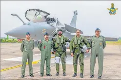  ??  ?? Air Chief Marshal RKS Bhadauria with Rafale pilots at the Air Force Station in Ambala on Wednesday.