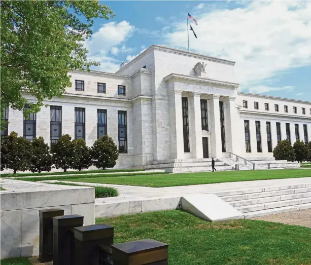  ??  ?? Policy review: The US Federal Reserve building in Washington DC. Now that global economic growth is revving up, policymake­rs are mulling about raising benchmark interest rates again. — AFP