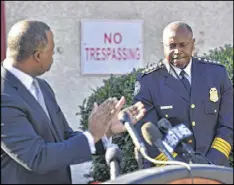  ?? HYOSUB SHIN / HSHIN@AJC.COM ?? Atlanta Police Chief George Turner receives applause from Mayor Kasim Reed during the groundbrea­king for the At-Promise Youth Center.
