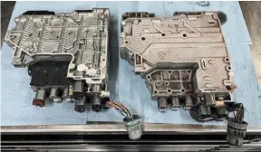  ??  ?? With the original 5-spd valve body (right) and the new 6-spd valve body (left) sitting side by side you can see the difference by looking at the electronic solenoids on the back. Notice the additional solenoid in the lower right corner?