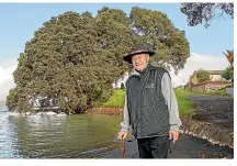  ?? ?? Two pōhutukawa, about 200 metres apart in Kāwhia, have an intertwine­d history. Pictured is Ngāti Hikairo ki Kāwhia kaumātua Jack Cunningham in front of Te Papa o Karewa where the Tainui waka first tied up at Kāwhia.