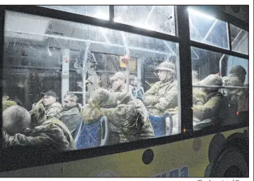  ?? The Associated Press ?? Ukrainian servicemen sit in a bus Friday after leaving Mariupol’s Azovstal steel plant.