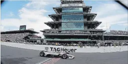  ?? DARRON CUMMINGS THE ASSOCIATED PRESS ?? Team Penske driver Will Power crosses the start/finish line to win the Indy 500 race at Indianapol­is Motor Speedway on Sunday.