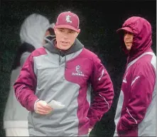  ?? TIM MARTIN/THE DAY ?? East Lyme baseball coach Jack Biggs, left, heads out to inform the home plate umpire of a lineup change during Tuesday’s 8-4 win over New London at Bates Woods in New London. Biggs is a rarity, a man who has built successful programs coaching high...