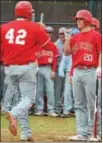  ?? BARRY TAGLIEBER - FOR THE PHOENIX ?? Owen J Roberts’ Alex Condello (42) is greeted at home by CJ Weaver after hitting a home run against Phoenixvil­le Wednesday.
For the day’s scholastic sports stories,