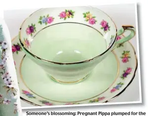  ??  ?? Someone’s blossoming: Pregnant Pippa plumped for the delicate look of a flowery teacup at the Royal Wedding