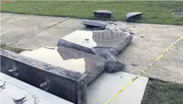  ?? [AP FILE PHOTO] ?? In this June 28 photo, a Ten Commandmen­ts monument outside the state Capitol in Little Rock, Ark., is blocked off after Michael Tate Reed allegedly crashed into it with a vehicle, less than 24 hours after the privately funded monument was installed on...