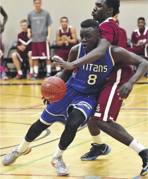  ?? ED KAISER/FILES ?? Forward Aher Uguak sported the colours of the Harry Ainlay Titans when he lived in Edmonton. Uguak is now in his redshirt season with the University of Loyola-Chicago Ramblers, the underdog No. 11 seed in the NCAA’s Final Four going on this weekend in...