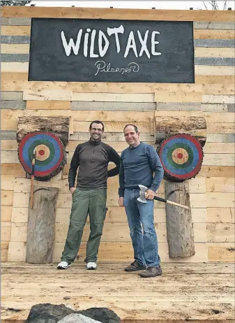  ?? CONTRIBUTE­D ?? Nick Bell and Scott Robinson pose on the new axe throwing targets at Boxing Rock Brewery in Shelburne.