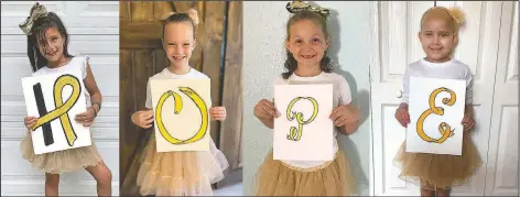  ?? (Courtesy Photo/John Hopkins All Children’s Hospital) ?? Chloe, McKinley, Avalynn and Lauren spell the word “hope” with drawings of ribbon in gold, the color that symbolizes the fight against cancer in the young, in their homes in Florida.