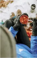  ??  ?? Keeping the body warm is an important safety factor during cold weather hikes. Eating warm foods can help to mitigate
this.