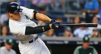  ?? GETTY IMAGES FILE PHOTO ?? New York Yankees’ Aaron Judge swings for the fence. Through Saturday, Major League Baseball was on pace for 6,117 home runs this season, which would shatter the record of 5,693 set in 2000.