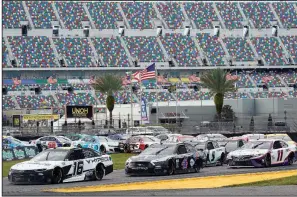  ?? (AP/John Raoux) ?? AJ Allmending­er (16) and Kevin Harvick (4) lead the field during a restart on lap 29 of the NASCAR Cup Series road-course race Sunday at Daytona Internatio­nal Speedway. Sunday’s race was the first of seven road races during the Cup Series circuit this season.