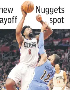  ??  ?? Los Angeles Clippers center DeAndre Jordan (left) is defended by Denver Nuggets guard DJ Augustin during an NBA game at Staples Centre. — USA TODAY Sports photo