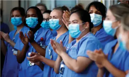  ??  ?? NHS workers outside the Royal London hospital in May. ‘Since 2010, public-sector pay has fallen behind the cost of living as the intentiona­l result of government policy.’ Photograph: Henry Nicholls/Reuters