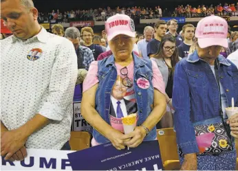  ?? Carolyn Cole / Los Angeles Times 2016 ?? Donald Trump supporters pray at a March 2016 campaign rally in Orlando. A substantia­l force behind the Trump vote has been middle-class fragility.