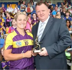  ??  ?? Player of the match Katrina Parrock with Pat Martin (Chairman).