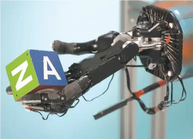  ?? Tim Hussin / New York Times ?? Robotic hands now can learn more complex tasks, rather than just what they have been programmed for.