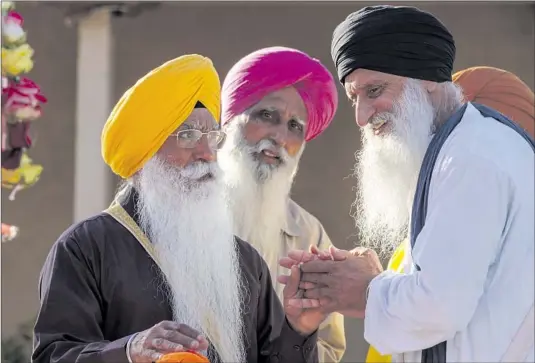  ?? “WE FIGHT Photograph­s by Irfan Khan Los Angeles Times ?? with the ballot not the bullet,” Sukhwinder Singh Sidhu, right, a member of Stockton’s Gurdwara Sahib, said of the movement for a Sikh nation.