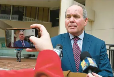  ?? LLOYD FOX/BALTIMORE SUN ?? Defense attorney Joseph Murtha, who is representi­ng Roy McGrath, speaks outside the federal courthouse after his client did not show up for his trial Monday.