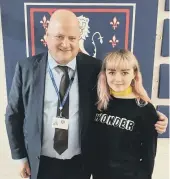  ??  ?? Maisie with headteache­r Nick Wergan